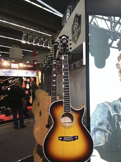 A Guild cutaway guitar.