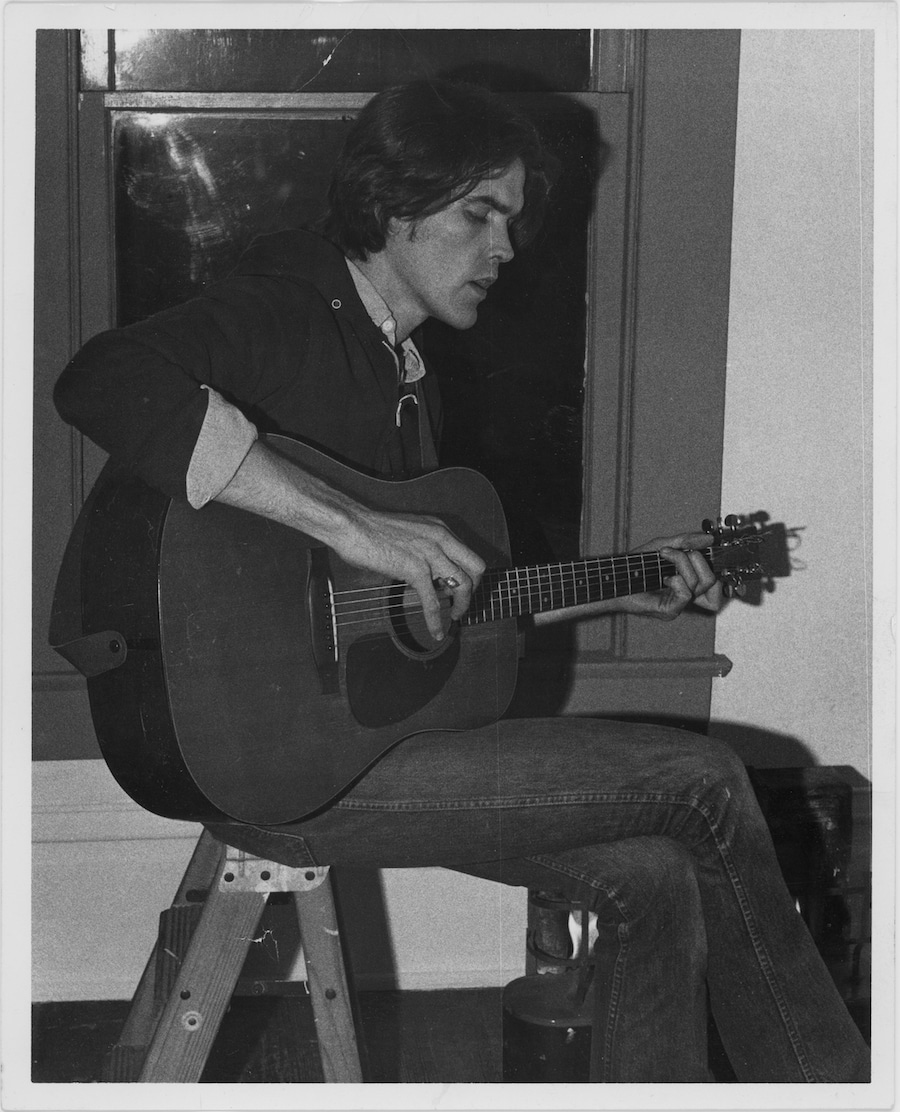 Guy Clark plays guitar in his home, circa 1973