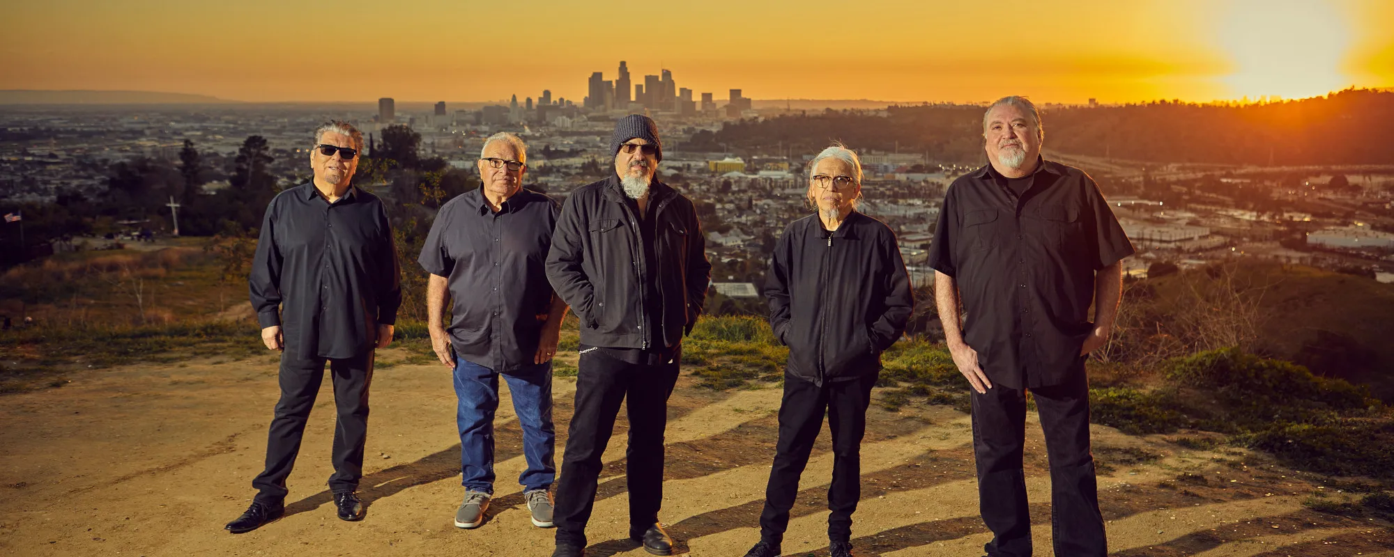 Review: Los Lobos Reveal Some Of Their Eclectic Influences On ‘Rising Sons’ Rousing Covers