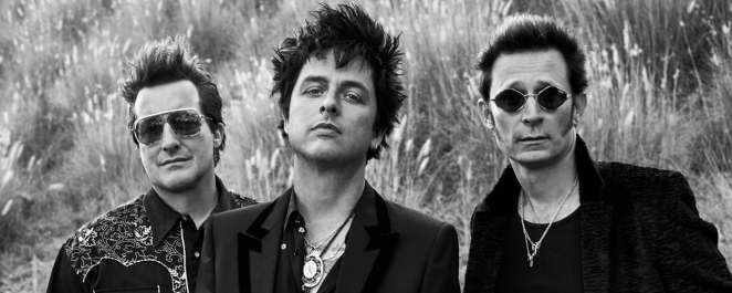 Green Day, known for their song "American Idiot," is pictured together.