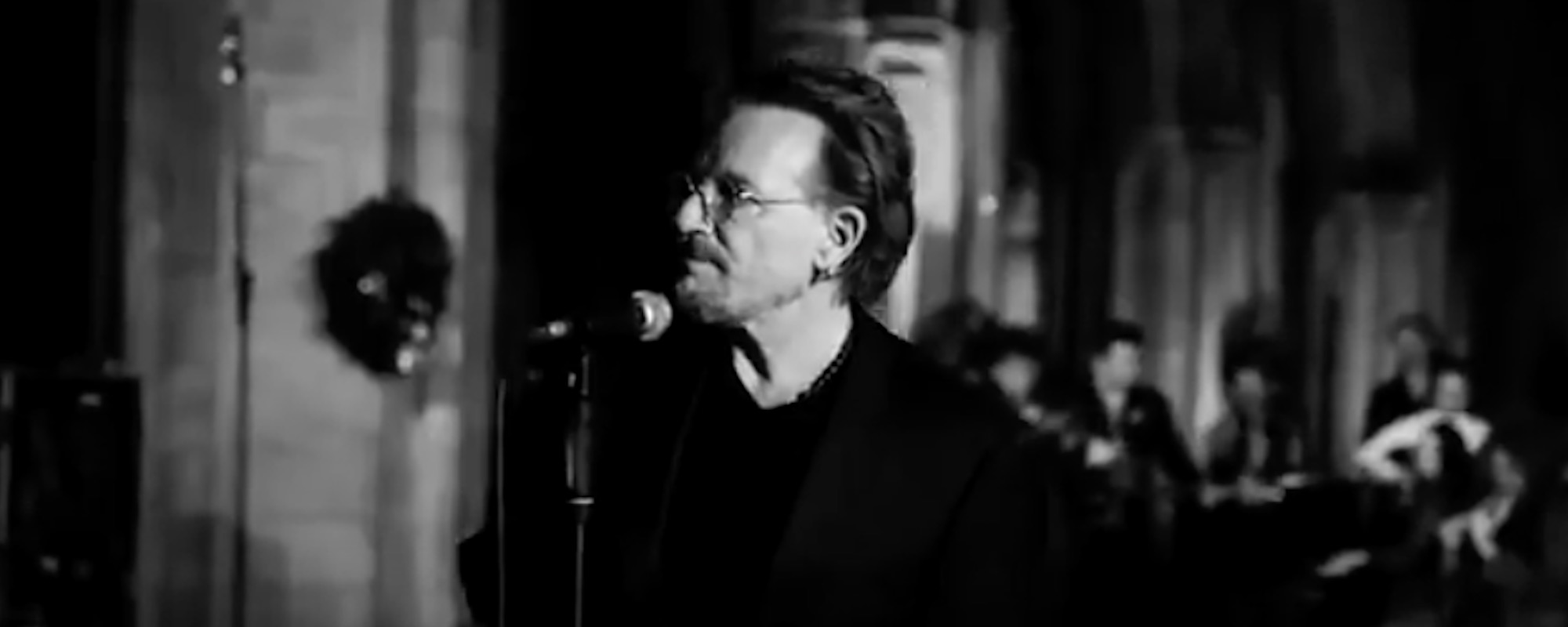 Bono ‘Busks’ for Charity in Dublin, Performs U2’s “Running to Stand Still”