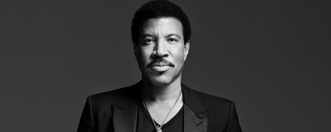 Lionel Richie, a famous balladeer of the '80s, looks at the camera.