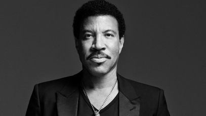 Lionel Richie, a famous balladeer of the '80s, looks at the camera.