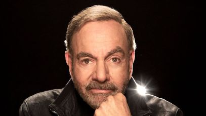 Neil Diamond, the singer and songwriter of "Sweet Caroline," looks directly at the camera.