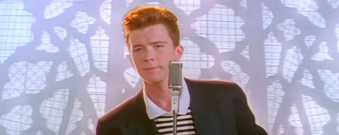 Rick Astley singing "Never Gonna Give You Up" in the song's music video.