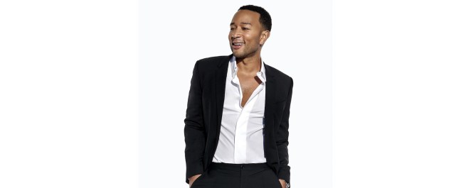 John Legend, an EGOT winner, poses while looking away from the camera.