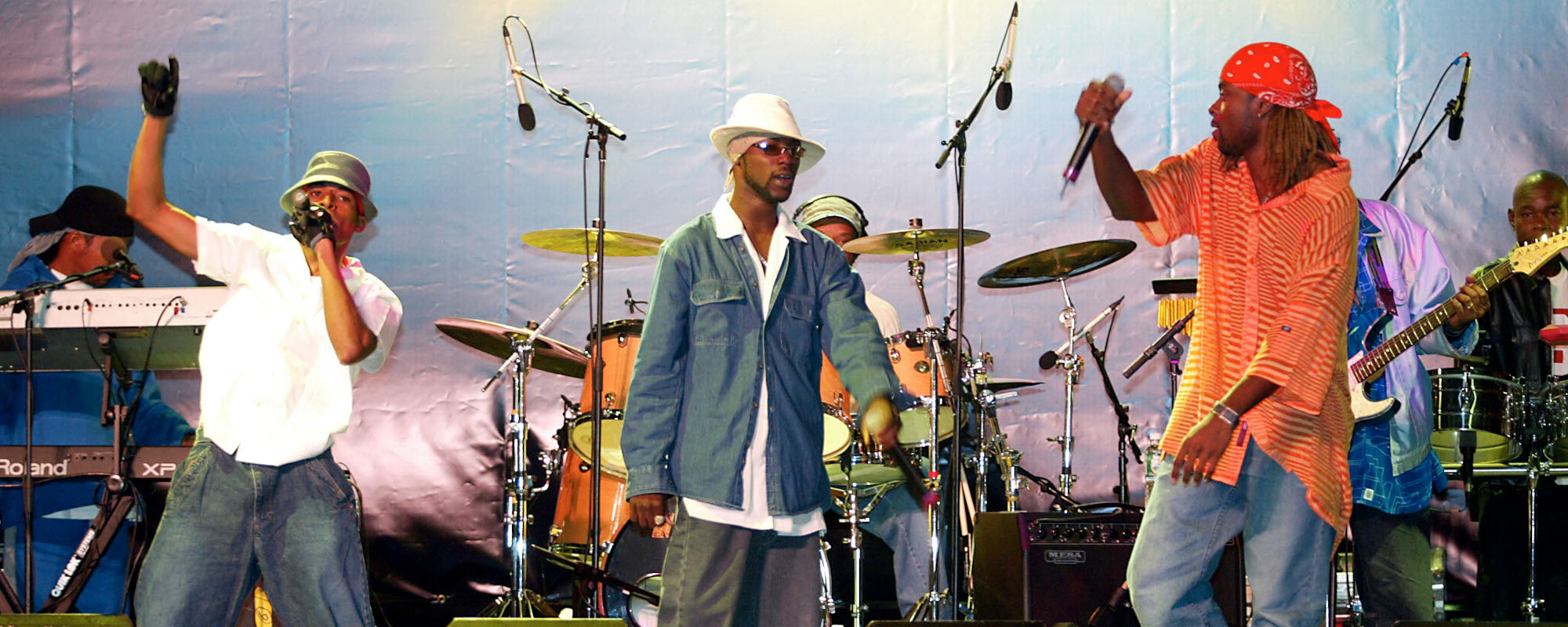 The Baha Men, the band who famously sings "Who Let the Dogs Out," is pictured performing live.