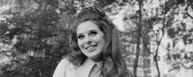 Bobbie Gentry, songwriter for "Fancy" sung by Reba, is pictured in black and white.