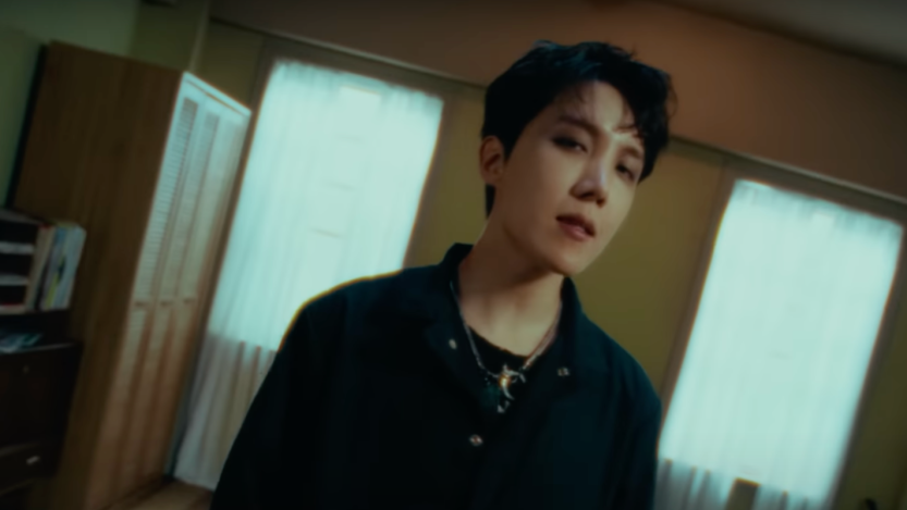 BTS member j-hope sings in his "MORE" music video before his debut solo album release.