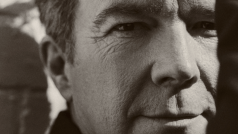 Ricky Astley is pictured looking directly at the camera 35 years after releasing "Never Gonna Give You Up."