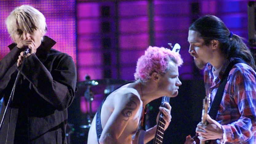 The Red Hot Chili Peppers perform together on stage in 1999, the year they released the album 'Californication.'