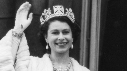 Queen Elizabeth II is photographed mid-wave early in her reign.