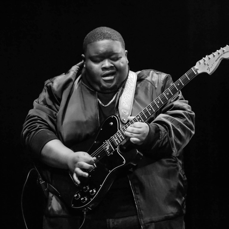 Christone “Kingfish” Ingram (Artist/Songwriter):GRAMMY® winning guitarist, vocalist and songwriter, Christone “Kingfish” Ingram has quickly become the defining blues voice of his generation. The now 24-year-old has headlined various national tours with Vampire Weekend, Jason Isbell, and Buddy Guy.