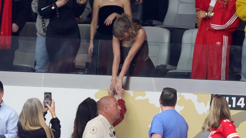 Taylor Swift interacts with a fan at Super Bowl LVIII in February 2024.