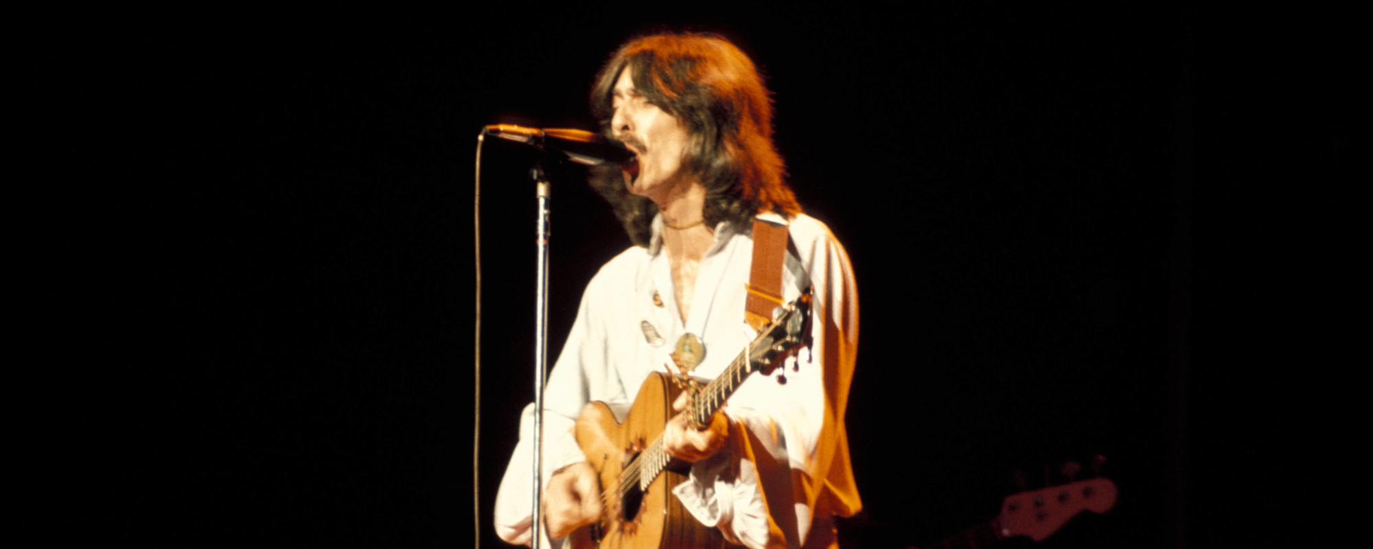 The Meaning Behind the Song “Cheer Down” by George Harrison and How It Got into a Hit Movie