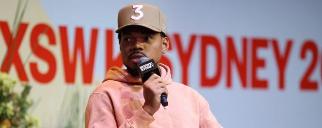 Chance the Rapper sports a pink hoodie and his signature "3" ballcap at SXSW Sydney in October 2023.