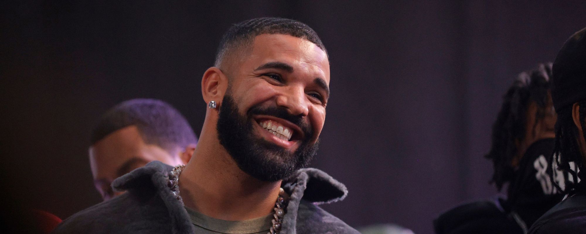 Drake smiles onstage during an October 2021 event in Long Beach, California.