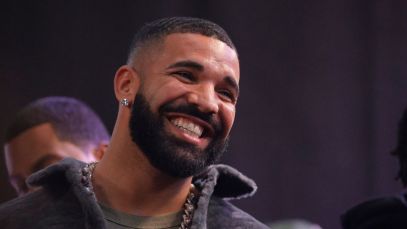 Drake smiles onstage during an October 2021 event in Long Beach, California.