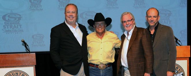 George Strait (second from left) and manager Erv Woolsey, to his right.