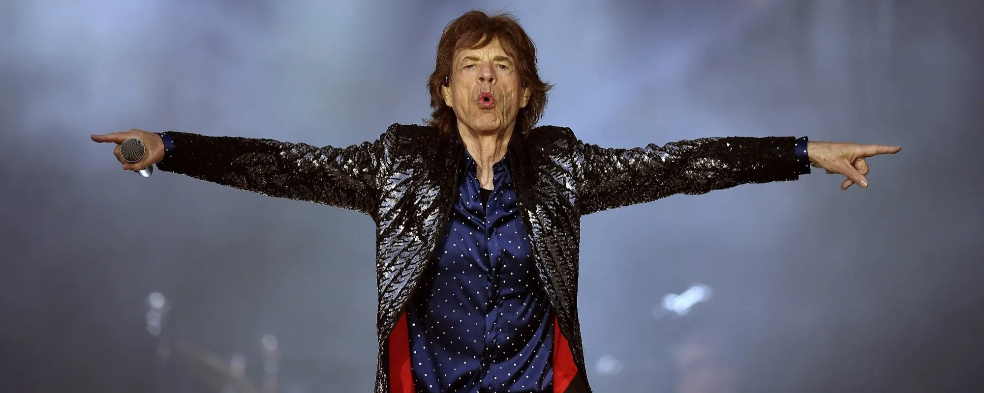 Watch Mick Jagger Rock Out on Guitar as He Prepares for The Rolling Stones’ 2024 Tour