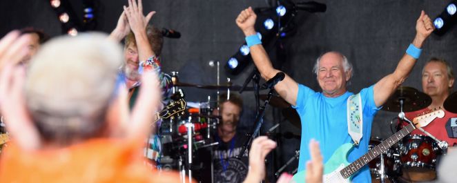 A grinning Jimmy Buffett raises his fists in the air triumphantly after performing on NBC's 'Today' in July 2016.