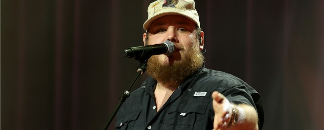 Luke Combs Says Tom Brady Beating Panthers Made Him Cry, Roasts NFL Owner David Tepper