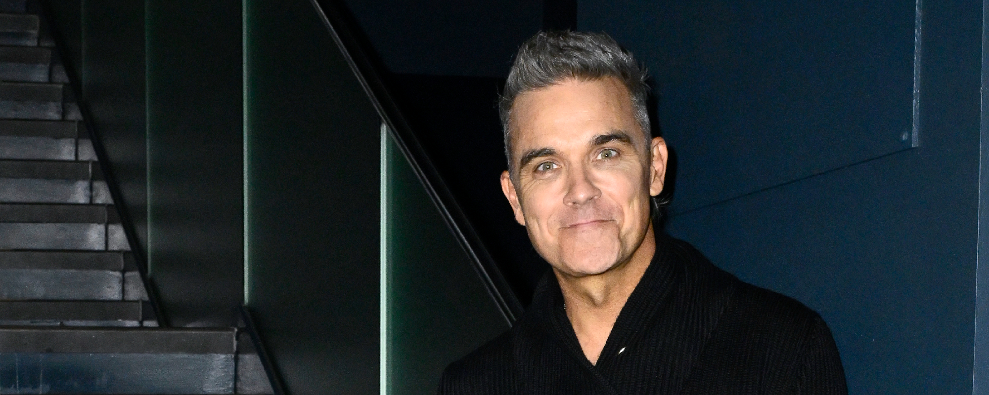Guy Chambers Reveals How His Head Was About to “Explode” When Recording “Angels” With Robbie Williams
