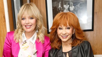 Reba McEntire in black and Melissa Peterman in pink in November 2023.