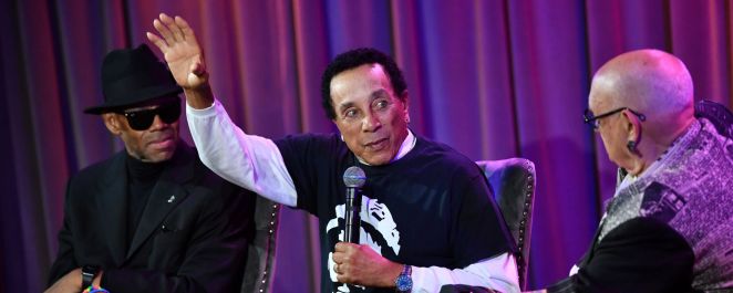Smokey Robinson gestures onstage at the GRAMMY Museum in August 2023.