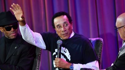 Smokey Robinson gestures onstage at the GRAMMY Museum in August 2023.