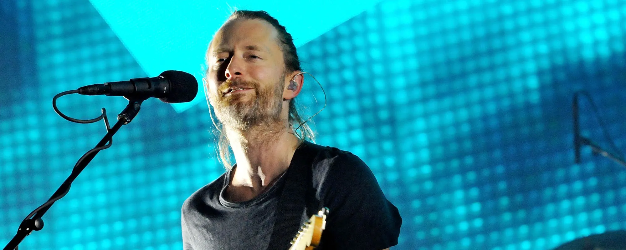 The Meaning Behind “No Surprises” by Radiohead and Why the Band Have to Play It Slow