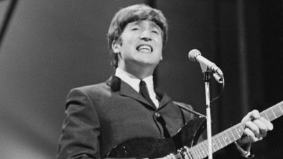 John Lennon singing, playing guitar