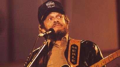 Merle Haggard performs on stage at the Country Music Festival held at Wembley Arena, London in April 1988.