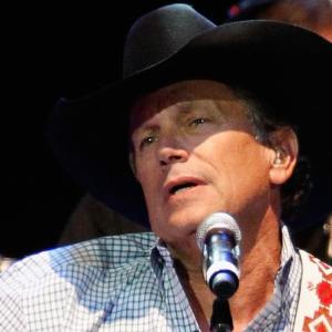 George Strait performs during Playin' Possum! The Final No Show Tribute To George Jones - Show at Bridgestone Arena on November 22, 2013 in Nashville, Tennessee.