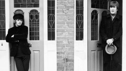 John Lennon and Ringo Starr standing together