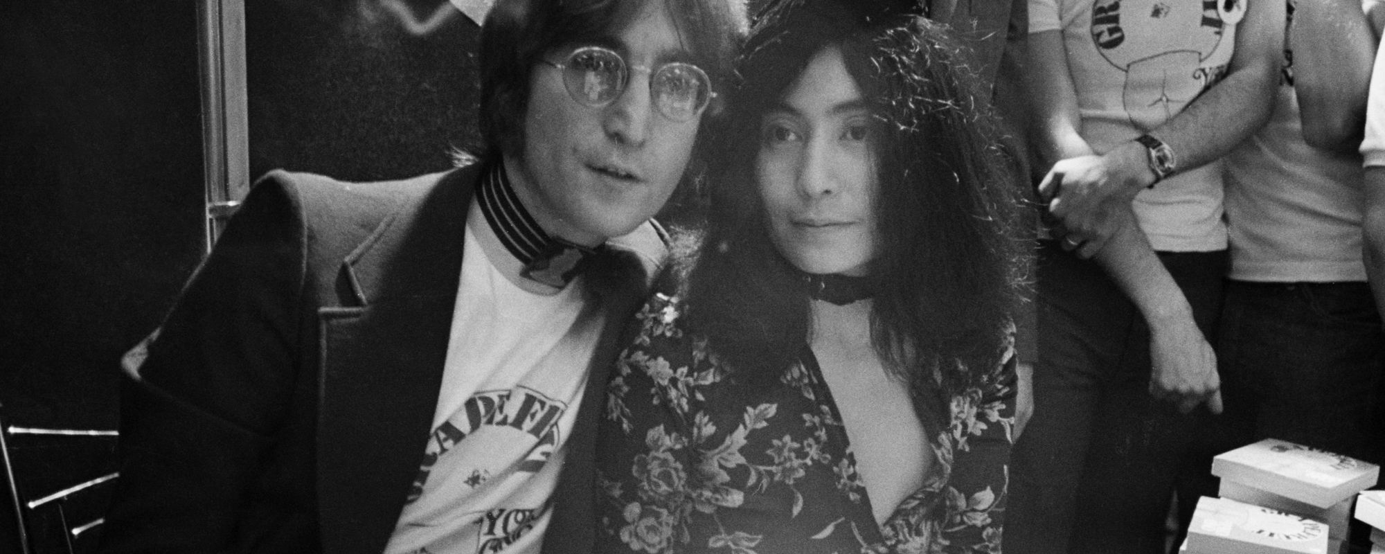 John Lennon and Yoko Ono sitting together