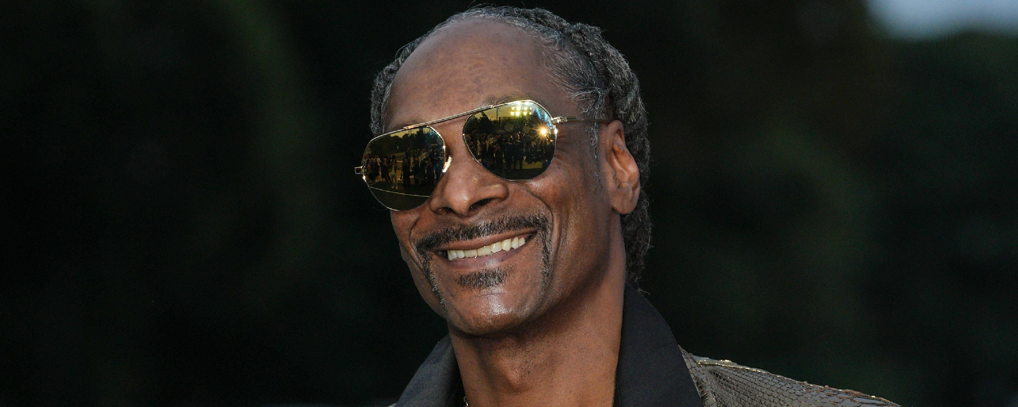 Snoop Dogg Carries the Olympic Torch Through Paris To Kick Off Games