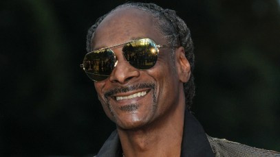 Snoop Dogg Carries the Olympic Torch Through Paris To Kick Off Games