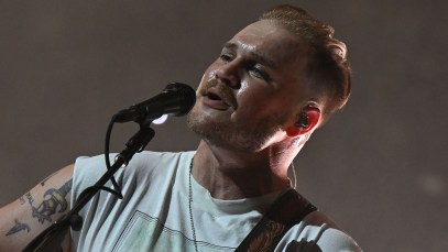 Zach Bryan Shocked When Fan Runs on Stage To Meet Him