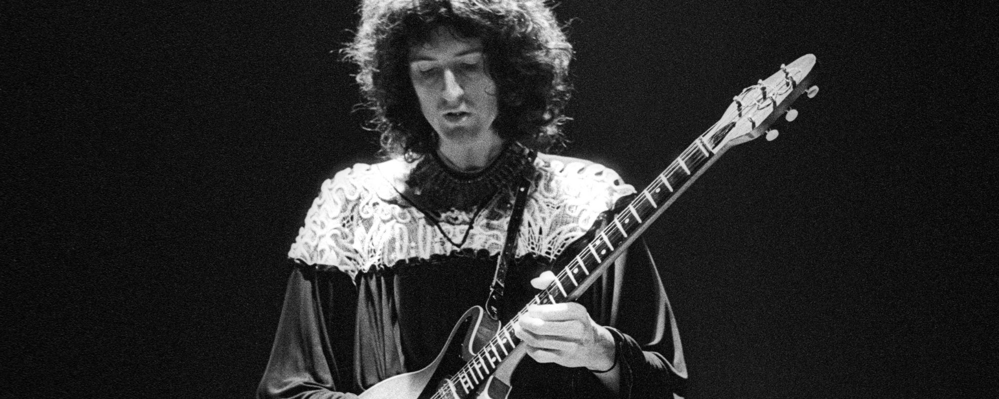 Brian May playing guitar