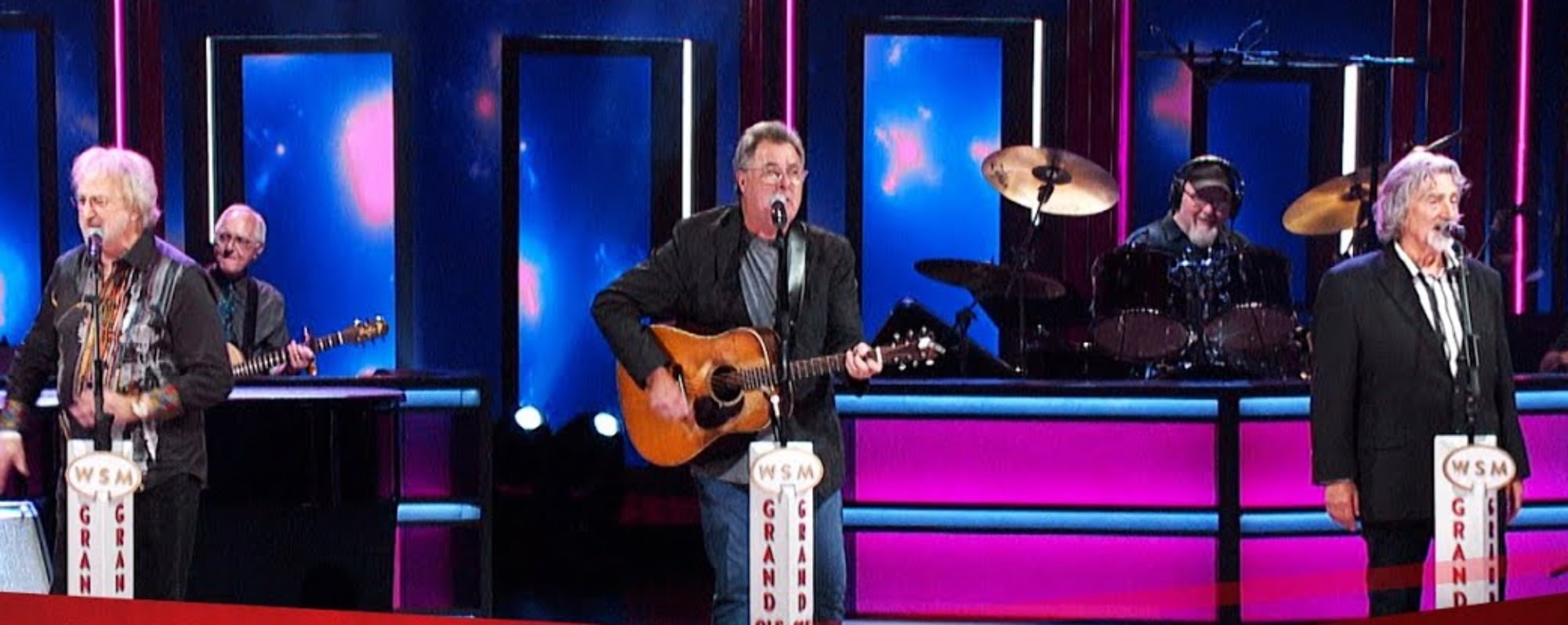 Watch Vince Gill and the Oak Ridge Boys Perform “Elvira” in Honor of the Late Joe Bonsall at the Grand Ole Opry