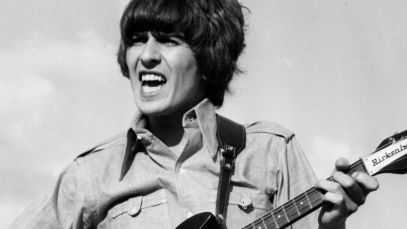 George Harrison playing guitar
