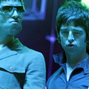 Liam and Noel Gallagher on stage