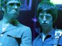 Liam and Noel Gallagher on stage