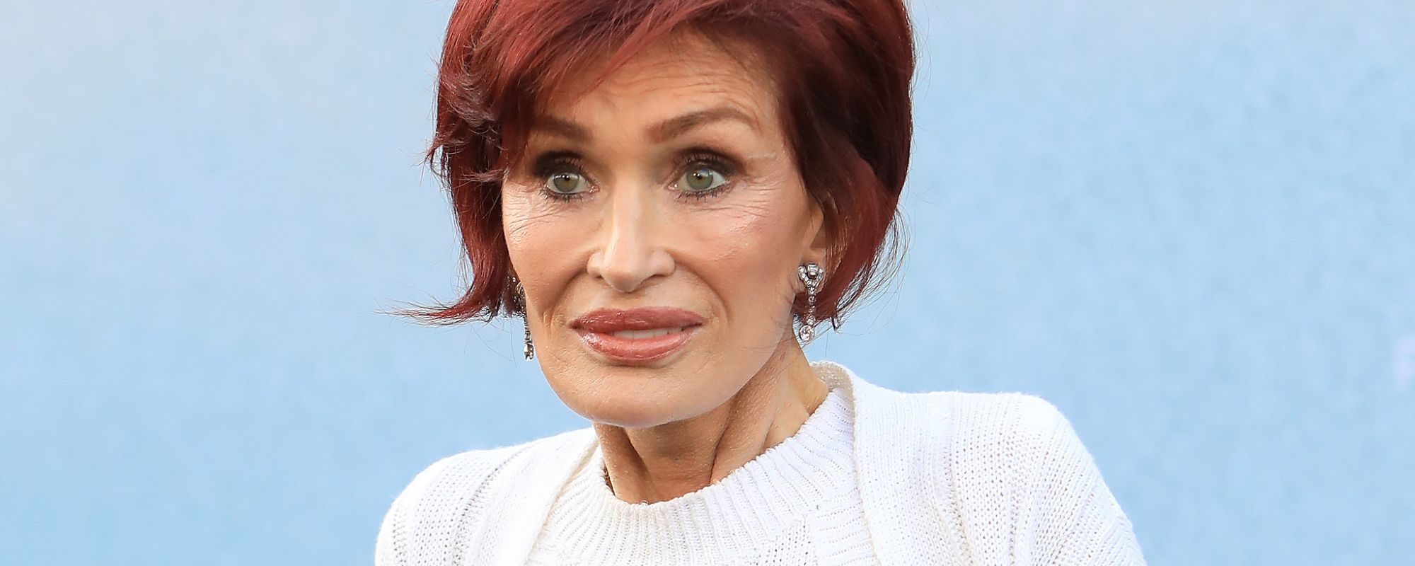 Sharon Osbourne looking off to side