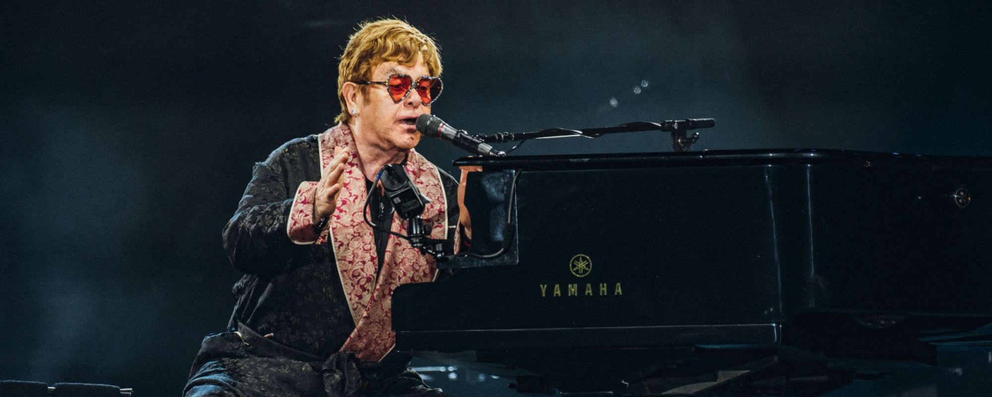 Elton John Shares Hopeful Message While Battling “Severe” Infection