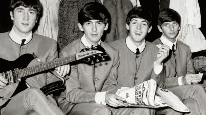 The Beatles sitting side by side