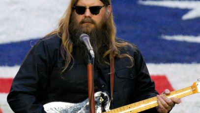 Chris Stapleton performing on football field