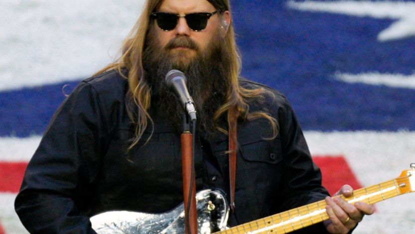 Chris Stapleton performing on football field