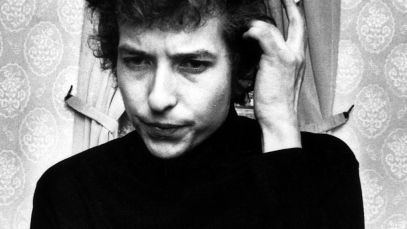 Bob Dylan scratching head, smoking cigarette